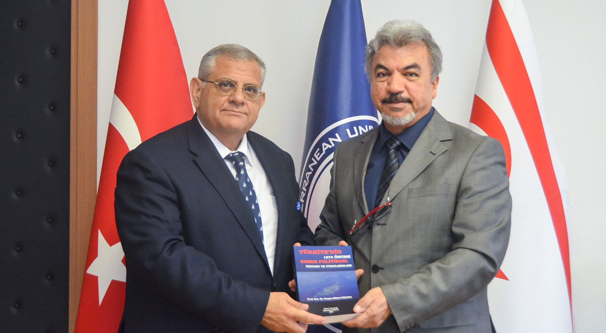 Asst. Prof. Dr. Göktürk Presents His New Book to Prof. Dr. Necdet Osam