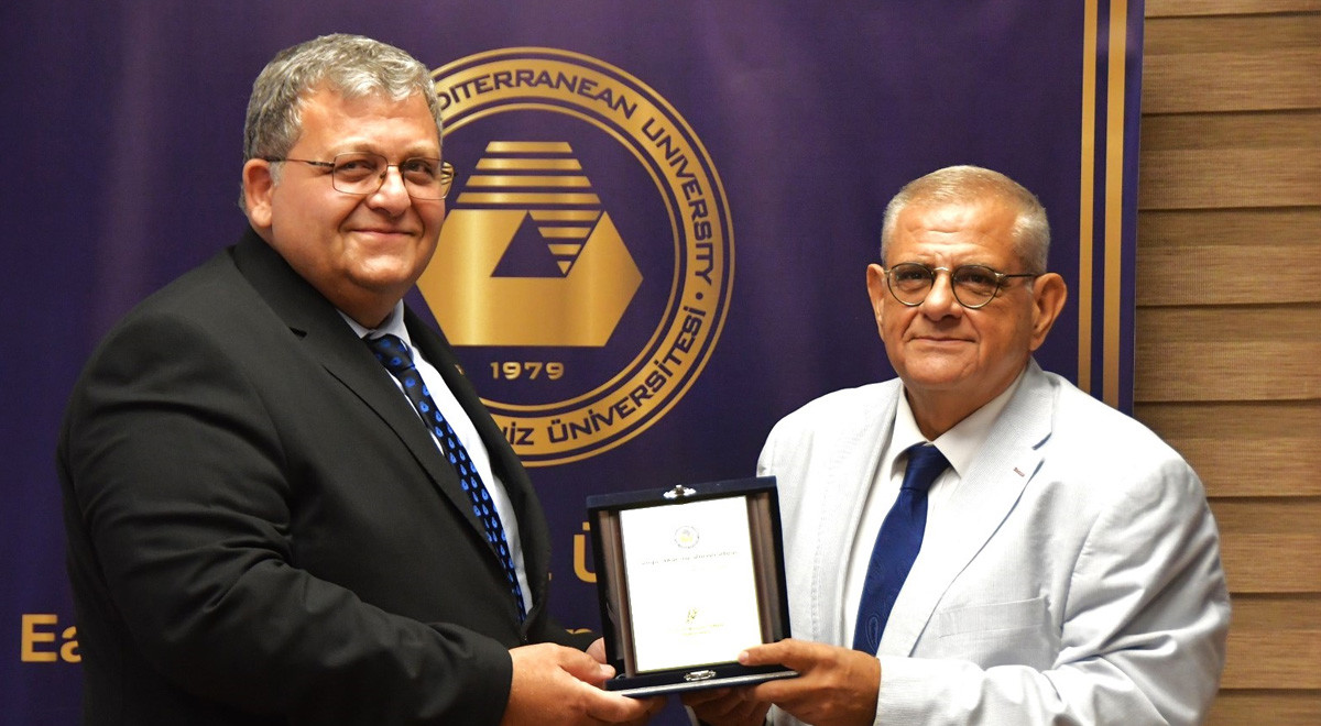 EMU Acting Rector Prof. Dr. Mustafa Tümer Presents Appreciation Plaque to Former Emu Rector Prof. Dr. Necdet Osam